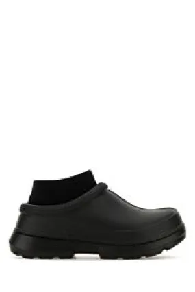 Black rubber Tasman slip ons     