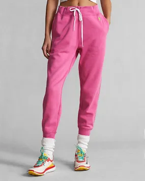 Jogger fucsia in felpa di misto cotone stretch con logo verde acido ricamato sul fianco